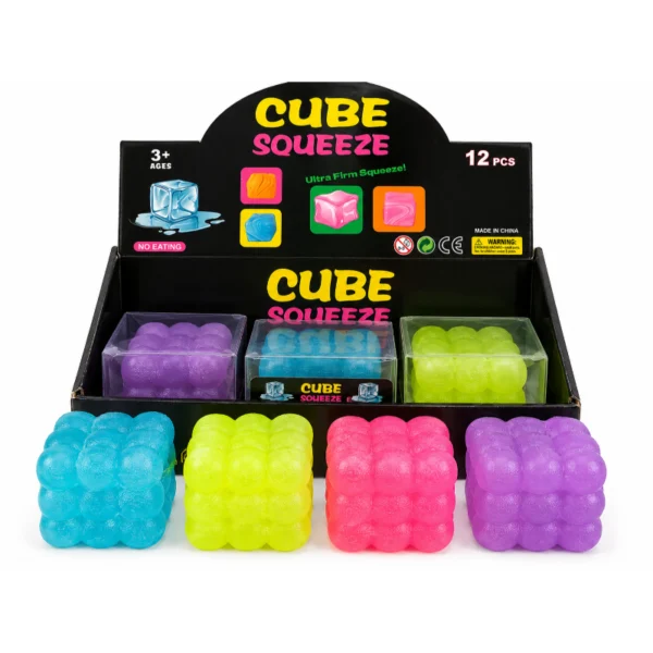 Cube Squeeze Bubble toys in assorted colours beside individual boxes and a retail display