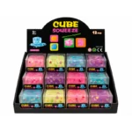 Cube Squeeze Fruit toys with fruit-themed pieces inside translucent cubes in a retail display