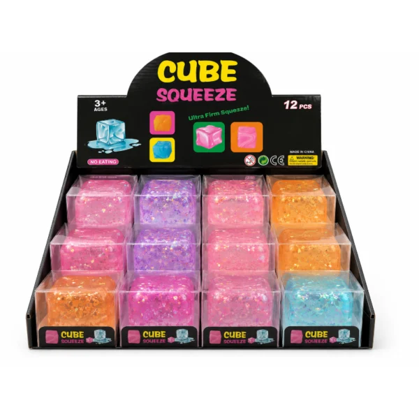 Cube Squeeze Glitter toys in pink, purple and orange shades inside a retail display
